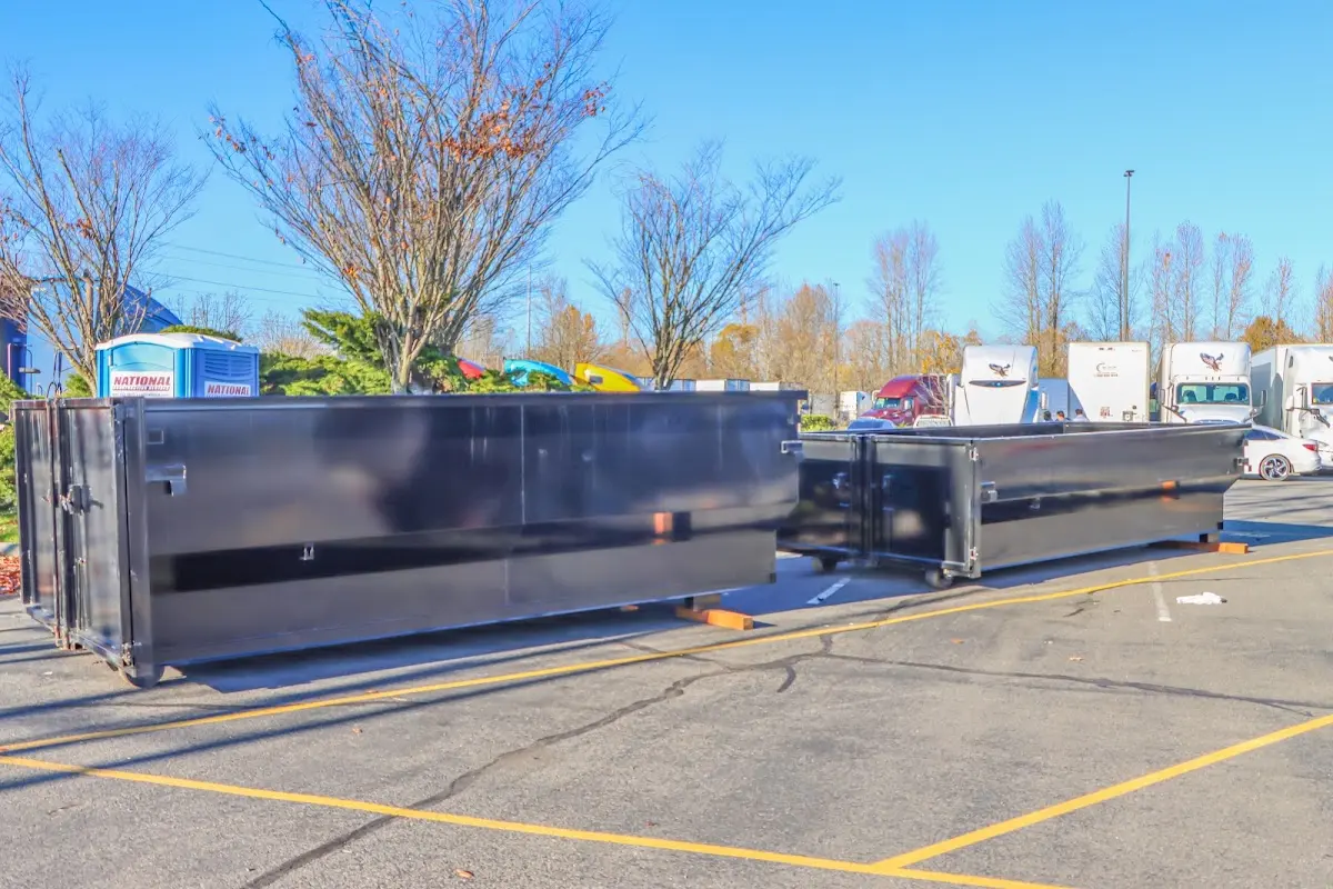 Professional dumpster rental service with roll-off container on residential driveway in Washougal